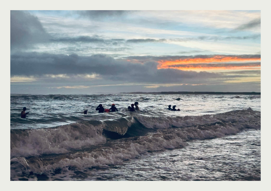 Bobbing around in the waves on the Welsh coast during a very cold full moon dip.