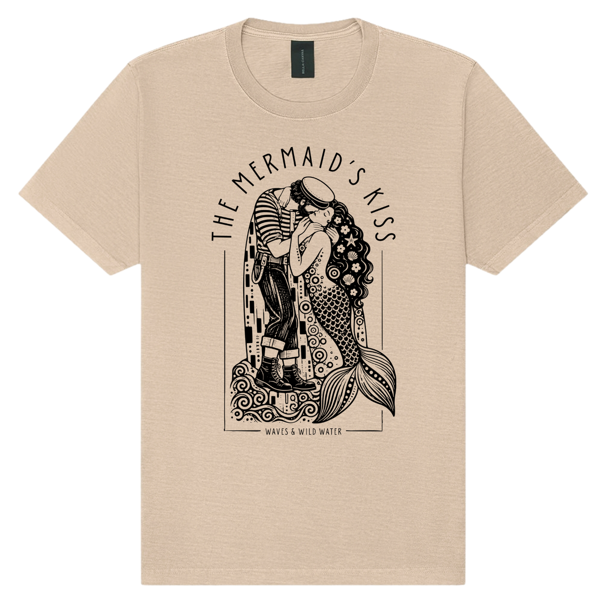 The Mermaid's Kiss washed cotton t-shirt in Golden Sand, featuring a black hand screen-printed sailor and mermaid embracing, inspired by Klimt's The Kiss. Exclusive to Waves & Wild Water. Hand printed in South Wales by a small veteran owned business.