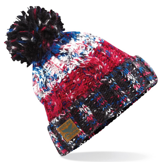 This vibrant red, white, and blue creation, complete with a playful pom pom, captures the spirit of the ocean while keeping you warm and cosy. With an inner shearling band to banish the dreaded head itch, it’s perfect for those post-dip moments or even just a brisk seaside walk.