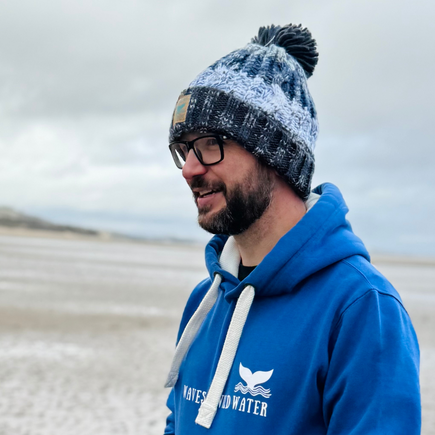 Not much wild swimming going on today - today is a day for wearing knitted pom pom beanie hats! Waves and Wild Water owner Glenn, wears his beanie in Frosty Morning Grey.