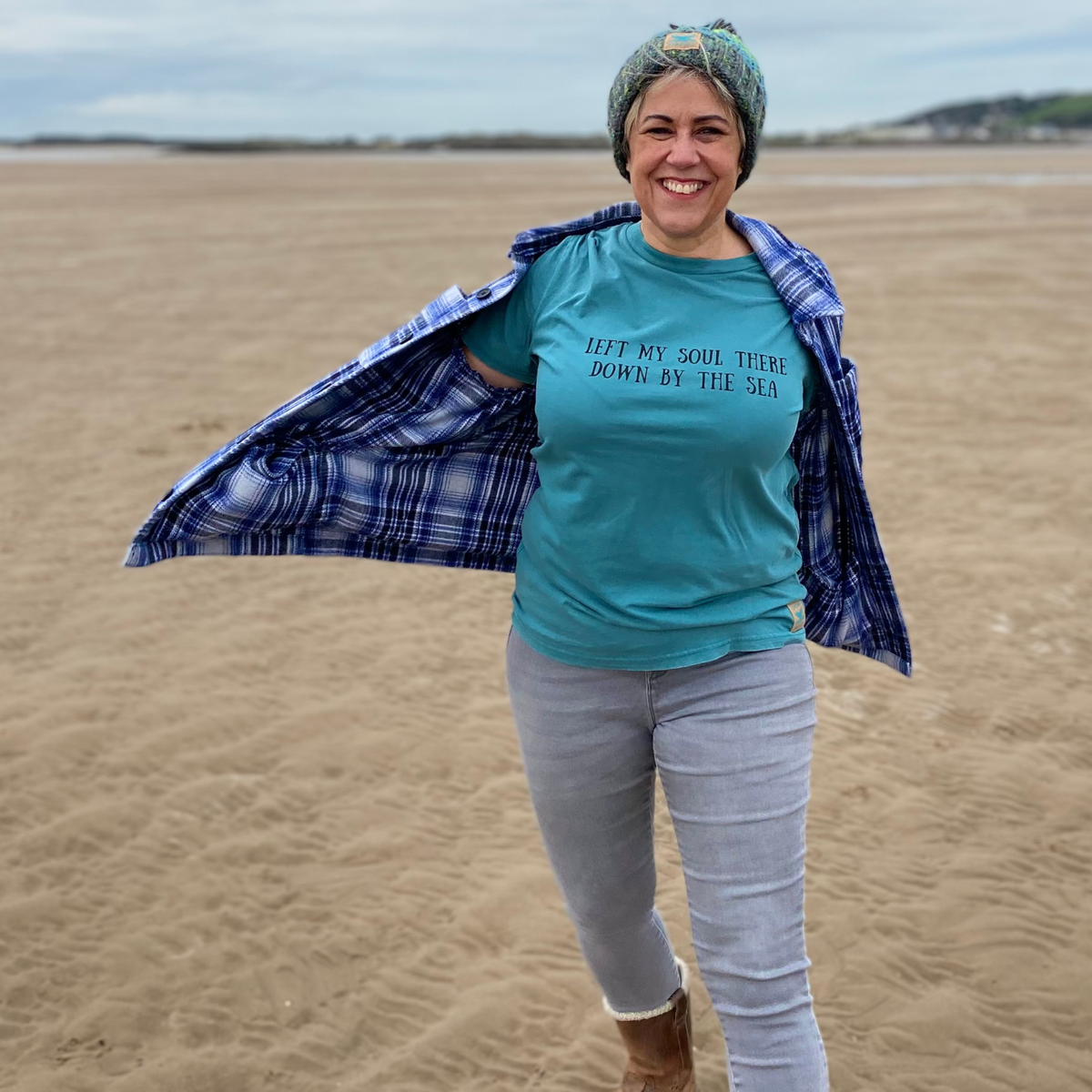 Waves and Wild Water owner Claire, teams her Lagoon knitted beanie with a Down By The Sea t-shirt - they look great together.