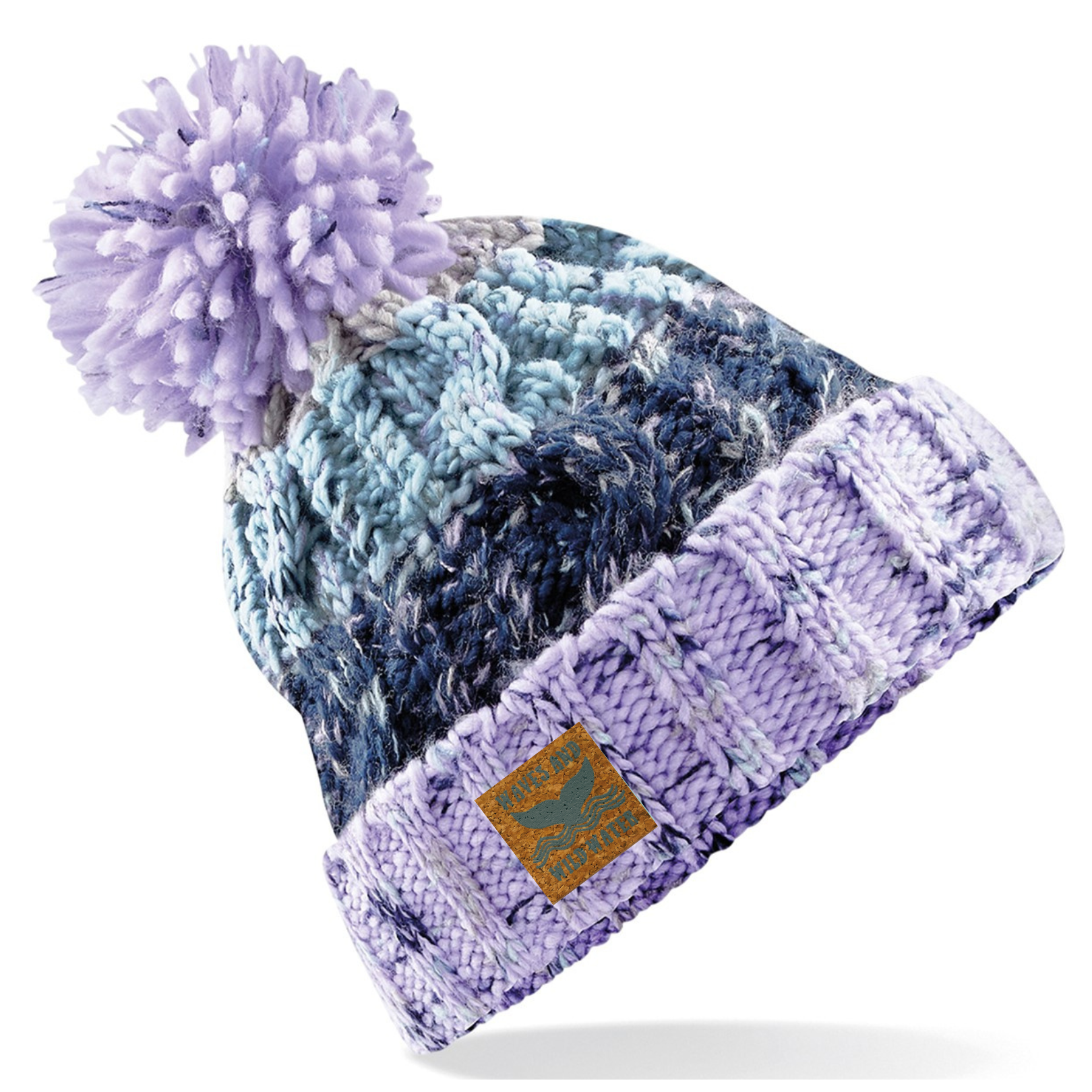 This hat is knitted in different shades of lilac, purple and blue. It has a deep fold up cuff which proudly displays the vegan leather Waves and Wild Water label. Finished with a fun fluffy pom pom, this hat is not only practical for keeping your head warm after a wild swim, it also looks great too.