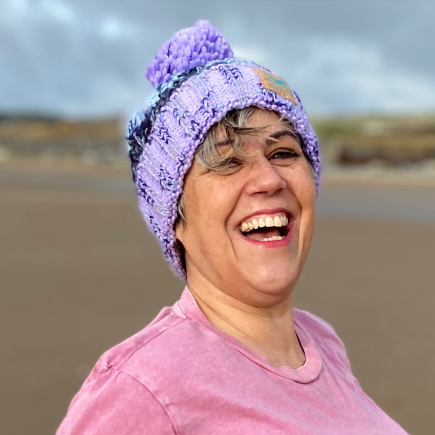 Claire LOVES this knitted beanie hat in gorgeous shades of lilac and blue! It's perfect for keeping your head after a cold water dip, but also looks fab just being worn on a windy beach walk with the dogs.