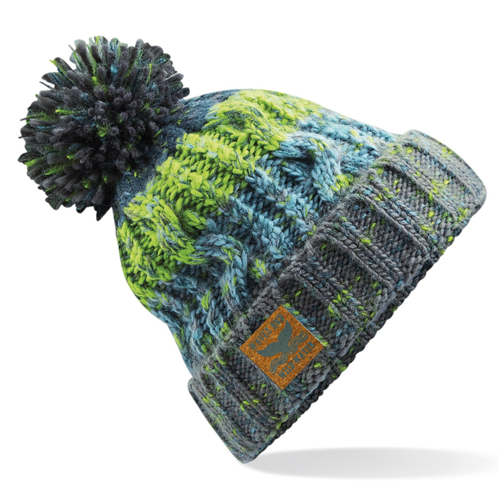 This hat is knitted in different shades of green and yellow. It has a deep fold up cuff which proudly displays the vegan leather Waves and Wild Water label. Finished with a fun fluffy pom pom, this hat is not only practical for keeping your head warm after a wild swim, it also looks great too. 