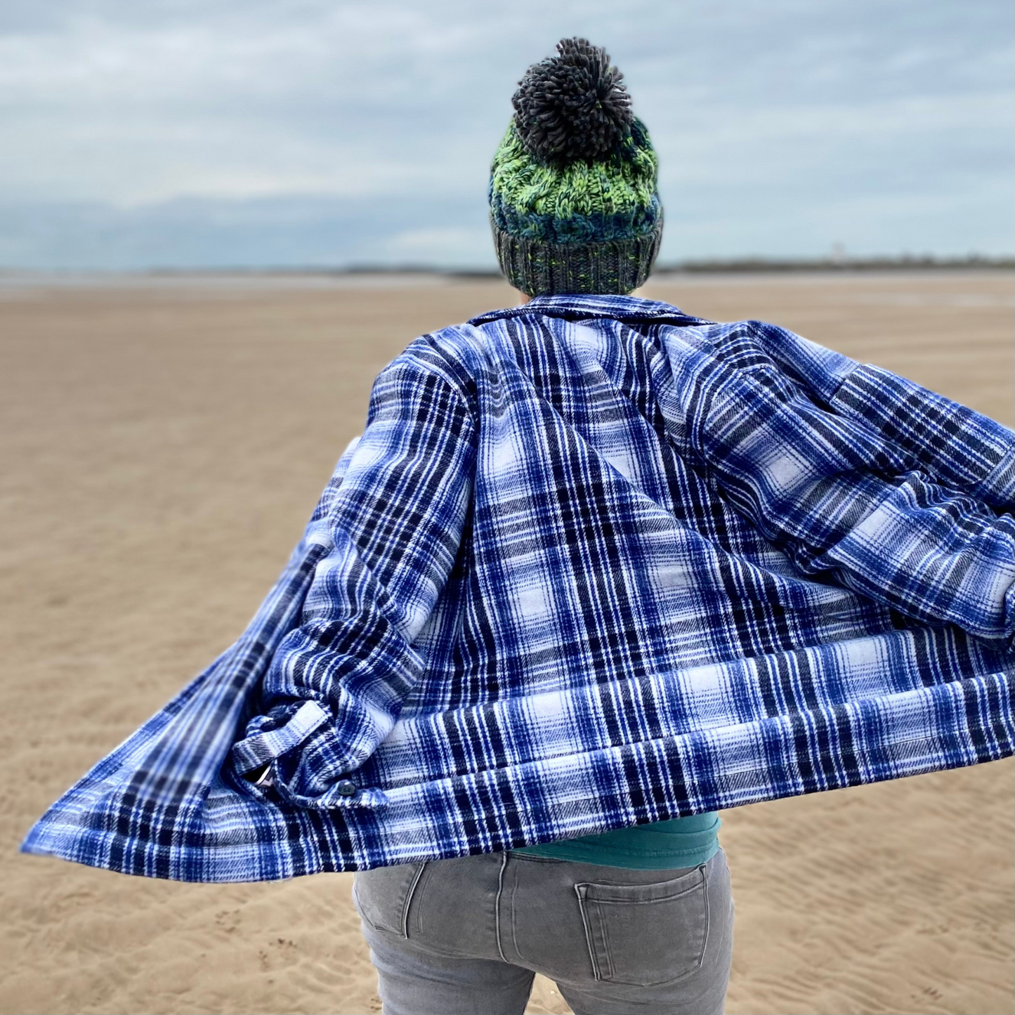 The back of this fab knitted beanie hat in green shades of the river bed looks just as great as the front! And check out that awesome statement pom pom on the top! It's no wonder the wild swimming community love these hats!