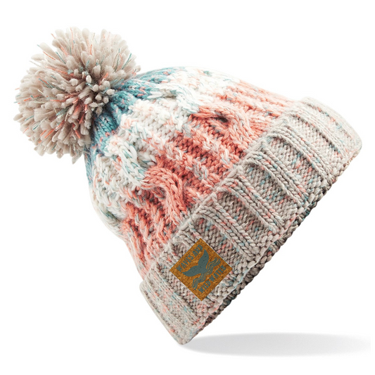 This Seashell Pink knitted pom-pom beanie hat is the perfect accessory for wild swimmers and sea dippers! With its playful blue, peach, and cream colour tones, this hat is sure to make a splash wherever you go.