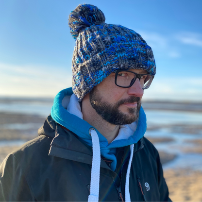 Waves and Wild Water owner Glenn warms up in his Ice Plunge chunky knitted beanie after a freezing dip in the sea.