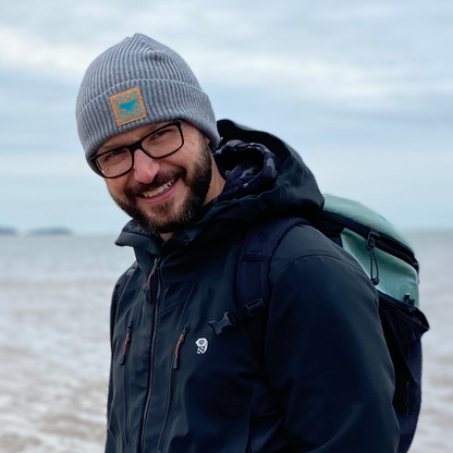 Waves and Wild Water owner Glenn, is wrapped up against the cold, especially his head, with his organic cotton fisherman beanie. This frosty morning grey hat not only looks after your head, but looks after the planet too.