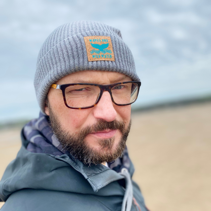 Glenn's fisherman beanie in Frosty Morning grey, shows off the iconic Waves and Wild Water label beautifully. Hand printed onto vegan cork 'leather', the label shows the fabulous whale tail coming out of the waves. 