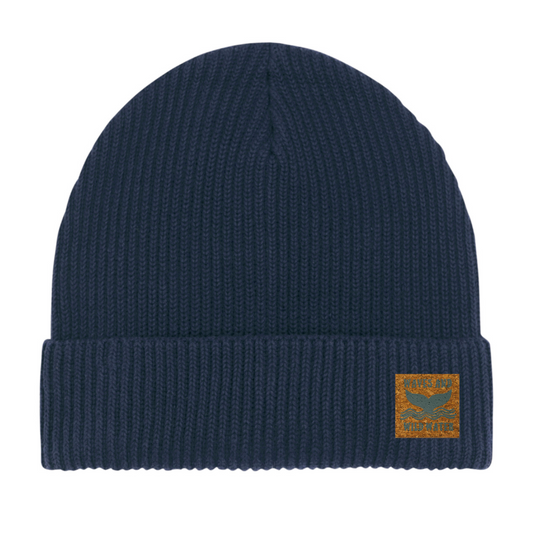 Midnight Waves navy blue fisherman beanie hat with vegan cork 'leather' label. This bestselling hat from Waves and Wild Water is loved by wild swimmers, sea dippers, and the cold water community.