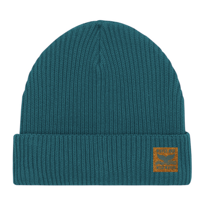 Stormy Sea fisherman beanie hat with vegan cork 'leather' label. This bestselling hat from Waves and Wild Water is loved by wild swimmers, sea dippers, and the cold water community.