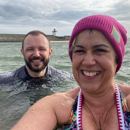 Waves and Wild Water owners, Claire and Glenn, enjoy some down-time in the sea on a cold October day. But, Claire is wearing her Water Lily fisherman beanie, so at least her head is warm!