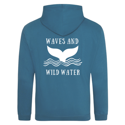 The back of the Waves and Wild Water stormy sea hoodie showing the large whale tail logo coming out of the waves. The logo is hand printed in white vegan ink and contrasts perfectly with the bright pink of the hoodie, making this the go to choice for wild  simmers and sea dippers.