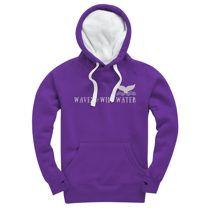 Purple pullover hoodie with small metallic silver Waves & Wild Water whale tail and text. Hand-printed in South Wales using vegan water-based inks.