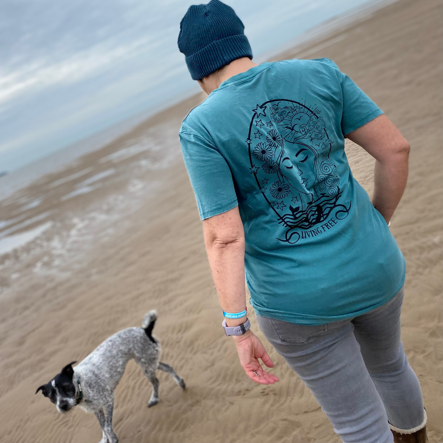 Claire from Waves and Wild Water is wistfully hoping the tide will come back in soon so she can go for a swim! In the meantime, she is enjoying a walk with her dog whilst wearing her vintage green sea inspired t-shirt, and dreaming of leaving her soul by the sea as the t-shirt design suggests.