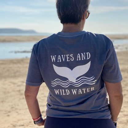 Owner Claire's back, showcasing the Waves and Wild Water logo in all it's glory in white print against a grey organic cotton tee.