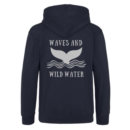 Midnight Waves navy hoodie featuring large metallic silver whale tail and wave design by Waves & Wild Water. For anyone who loves wild swimming and sea dipping adventures.
