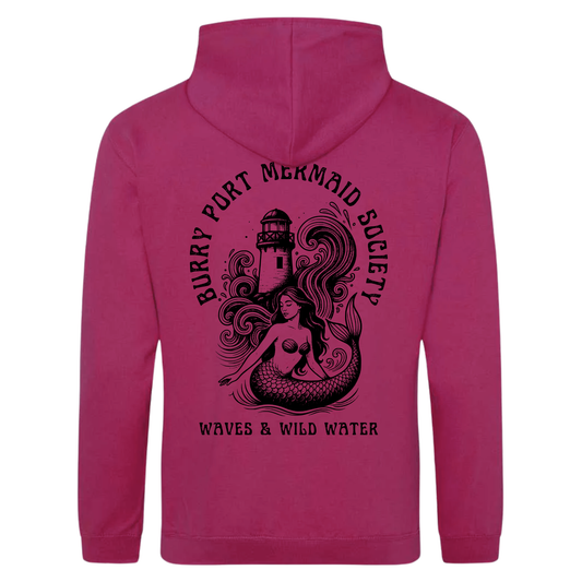 Sunset Serenade pink hoodie featuring large Burry Port Mermaid Society mermaid and lighthouse design by Waves & Wild Water.