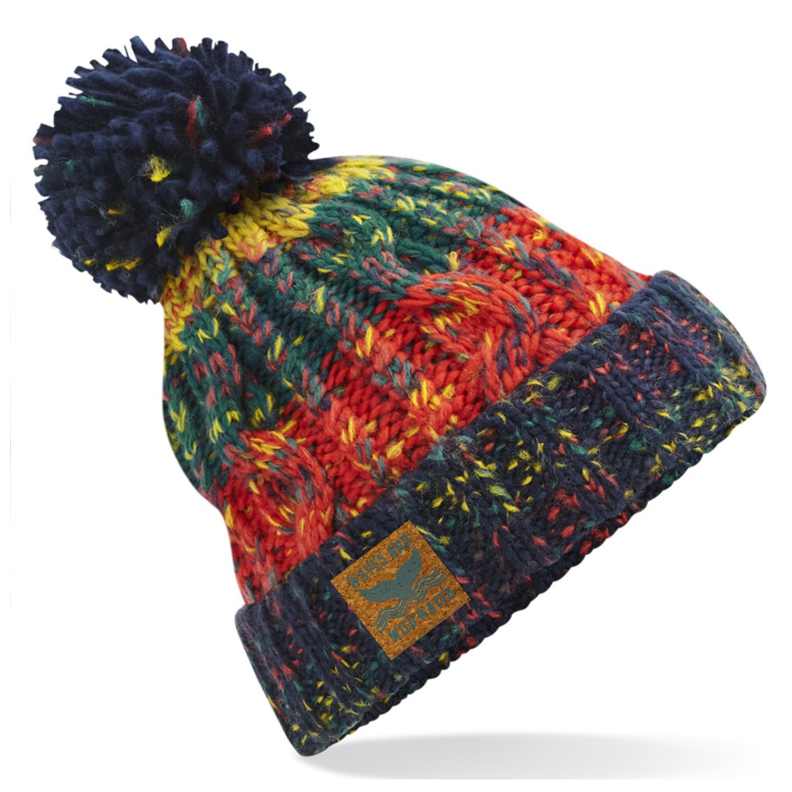 A navy, orange and green knitted beanie hat with a pom pom.