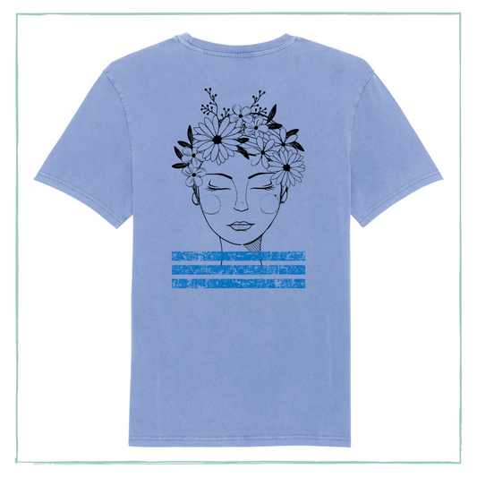A vintage blue t-shirt with the image of a woman with flowers in her hair printed on it.